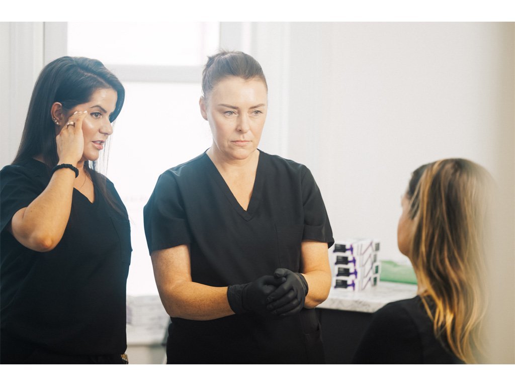 Dr Lauren teaching one of her students at the ATA her methodology of knowing where to inject botox and other dermal fillers to a patient's face.