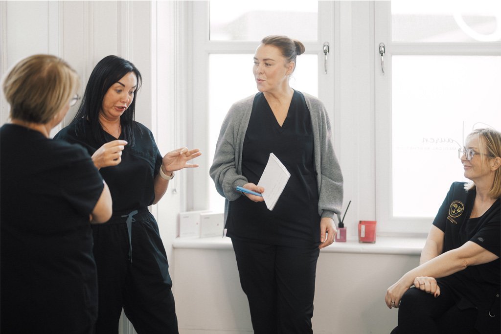 Students at the ATA discussing their path to the medical aesthetics field.