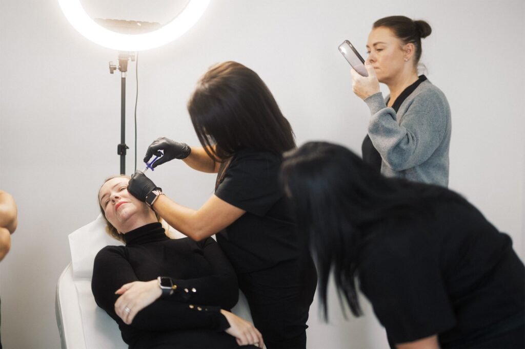 Dr Lauren teaching her students at the ATA how to inject dermal fillers.