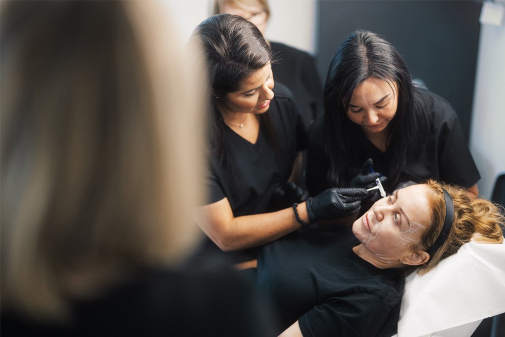 Dr Lauren teaching her students placement of dermal filler.