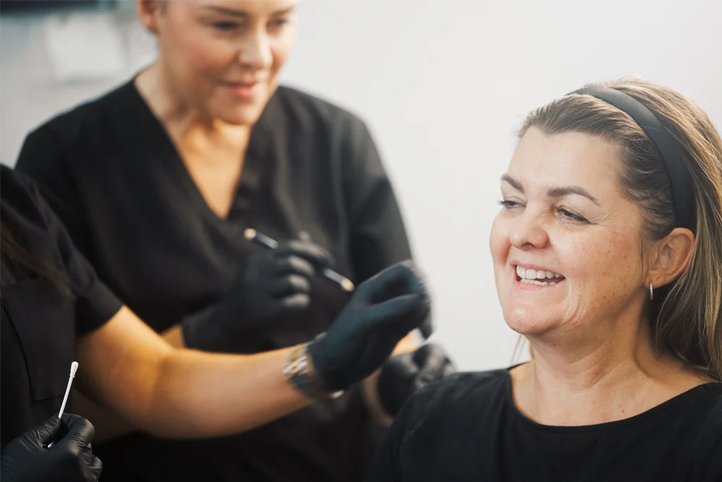 Students learning about facial anatomy through a model patient at the ATA.