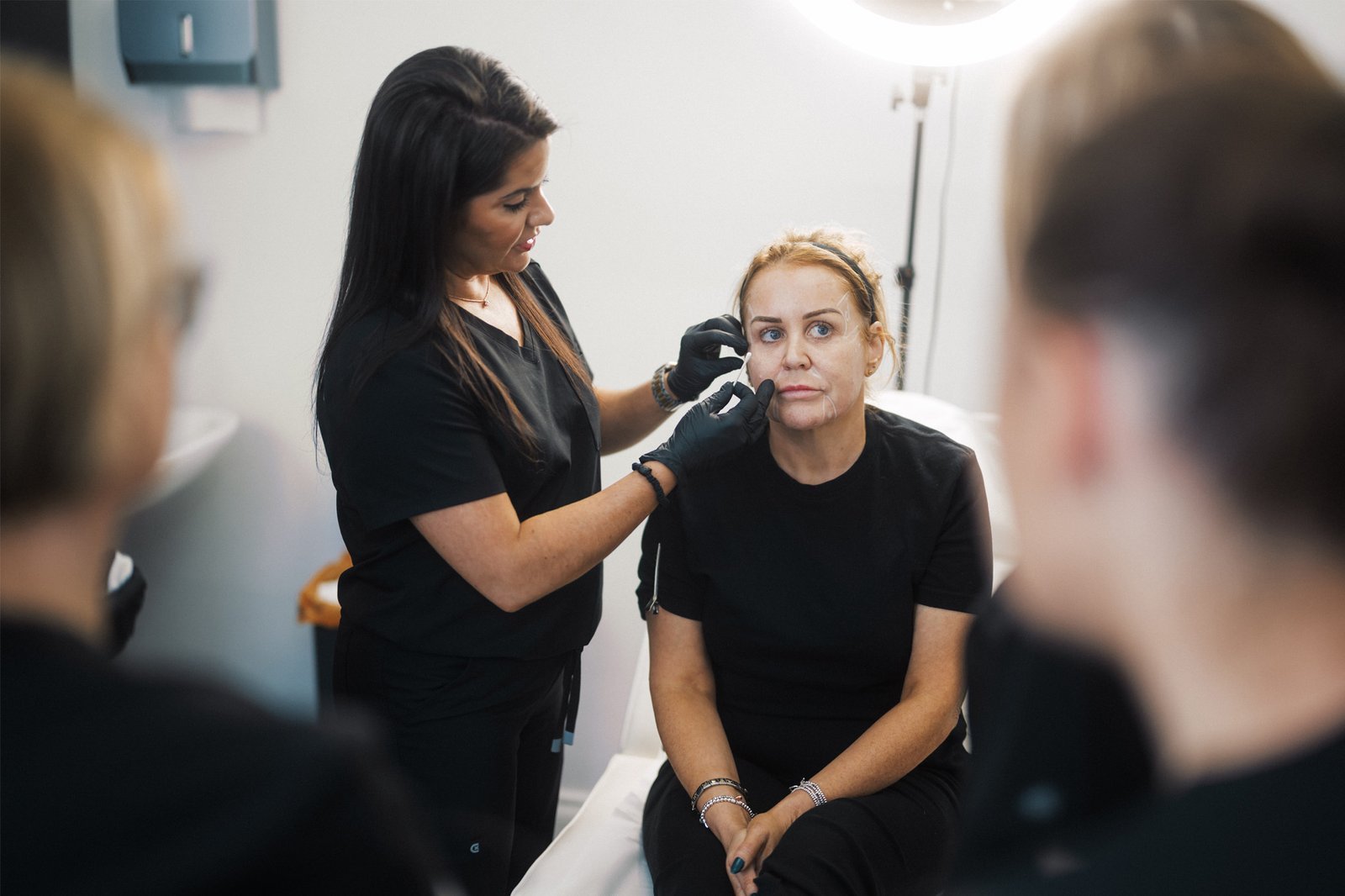 Dr Lauren teaching facial anatomy to students at the ATA.