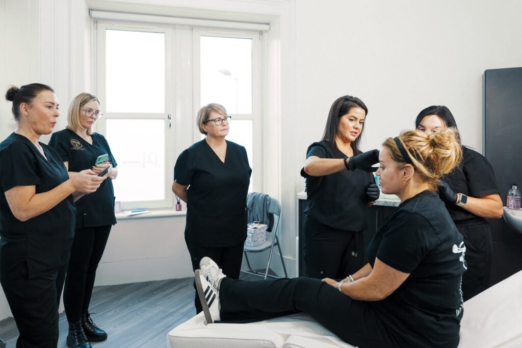 Dr Lauren teaching her students the anatomy of the female face at the ATA.