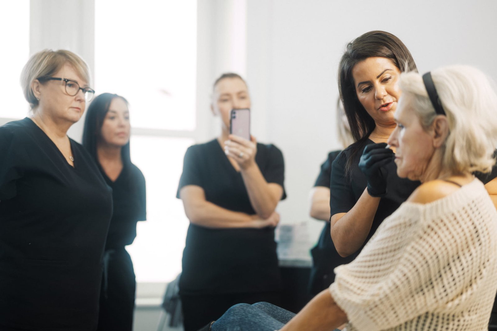 Dr Lauren teaching her students at the ATA the skin structure of a mature face.